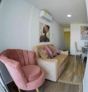 a living room with a couch and two chairs at Exclusive House Cartagena in Cartagena de Indias