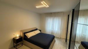 A bed or beds in a room at Casa Veronica nel cuore di Padova
