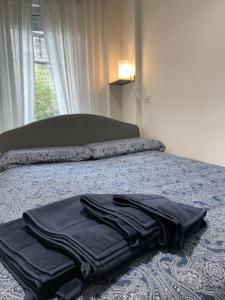 A bed or beds in a room at Casa Veronica nel cuore di Padova