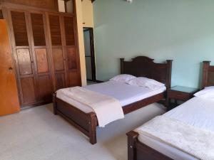 Postel nebo postele na pokoji v ubytování HOSTAL HELICONIAS
