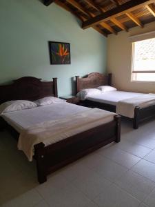 Naktsmītnes HOSTAL HELICONIAS pilsētā Charalá fotogalerijas attēls +34 fotogrāfijas