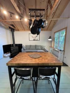 a kitchen with a table with chairs and a couch at Leland’s Lakehouse in Wolfville