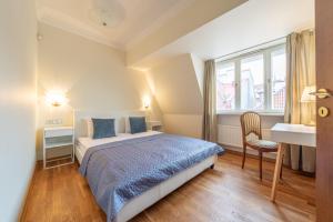 Postel nebo postele na pokoji v ubytování Old Town - Hall Square Apartment