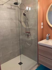 a shower with a glass door in a bathroom at Milady Ocean View in Biarritz