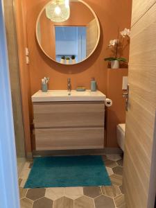 a bathroom with a sink and a mirror at Milady Ocean View in Biarritz