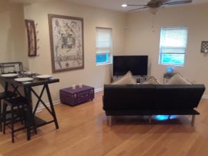 a living room with a couch and a table at Lovely 1-Bedroom/Near FedEx Field/Close to DC 