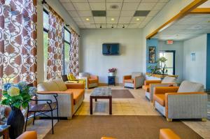 a waiting room with couches and tables in a hospital at Motel 6-Ashland, VA in Ashland