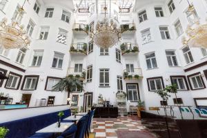 a building with tables and chairs in front of it at Best Western Hotel Bentleys in Stockholm