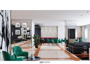 ein Wohnzimmer mit grünen Stühlen und einem Tisch in der Unterkunft Hotel Marc'Aurelio in Rom