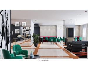 a living room with green chairs and a table at Hotel Marc'Aurelio in Rome