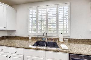 a kitchen with a sink and a window at Paradise Valley Vacation Home in Phoenix