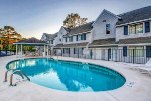 a swimming pool in front of a house at Fairway Village - B6 in Myrtle Beach