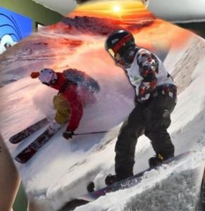 a picture of two people skiing on a cake at Cabañas y condominio los pretiles in Pinto