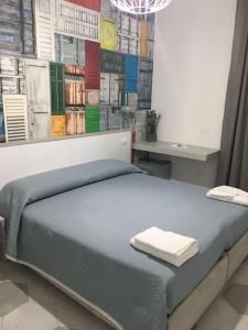 Posteľ alebo postele v izbe v ubytovaní B&B Le due costiere