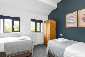 Un ou plusieurs lits dans un hébergement de l'établissement Forester House - Spacious 4 Bedroom in Derby, City Centre