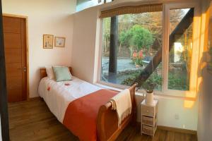 Postel nebo postele na pokoji v ubytování Espectacular Loft en Zapallar