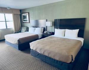 Postel nebo postele na pokoji v ubytování Quality Inn Durango