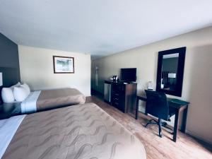 Postel nebo postele na pokoji v ubytování Quality Inn Durango