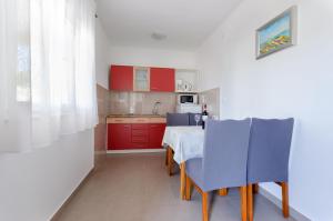 Kuchyňa alebo kuchynka v ubytovaní Apartments Slavica