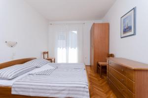 Posteľ alebo postele v izbe v ubytovaní Apartments Slavica