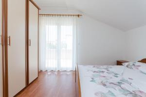 Posteľ alebo postele v izbe v ubytovaní Apartments Slavica