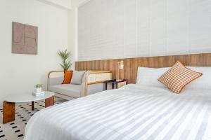 Voodi või voodid majutusasutuse Choco Style Inn toas