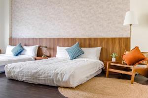 Voodi või voodid majutusasutuse Choco Style Inn toas