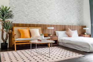 Voodi või voodid majutusasutuse Choco Style Inn toas