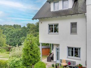 a white house with a view at Apartment between Winterberg and Willingen in Medebach