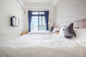 Voodi või voodid majutusasutuse Choco Style Inn toas