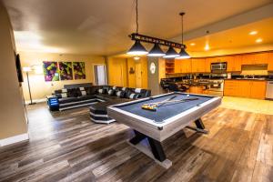 a living room with a pool table in it at 2100 SqFt Penthouse Suite W/ Strip Views! POOL GYM in Las Vegas