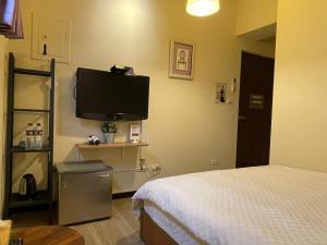 Μια τηλεόραση ή/και κέντρο ψυχαγωγίας στο 台中一中街格雷熊
