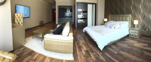 Ένα ή περισσότερα κρεβάτια σε δωμάτιο στο Wakra Inn Hotel Apartments