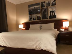 Ένα ή περισσότερα κρεβάτια σε δωμάτιο στο Wakra Inn Hotel Apartments