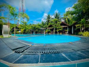 a swimming pool at a resort at Trinco Star Cabana in Trincomalee