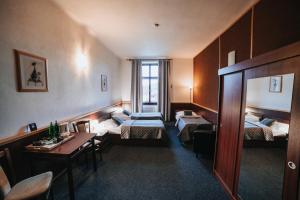 Posteľ alebo postele v izbe v ubytovaní Hotel Centrum