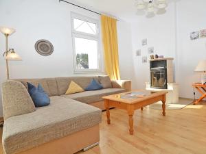 a living room with a couch and a coffee table at Villa Sanssouci - Apt. 02 in Ostseebad Sellin