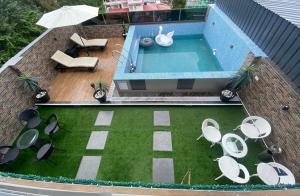 an overhead view of a backyard with a swimming pool at The Relyn Suite in Shillong