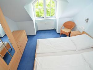 Postel nebo postele na pokoji v ubytování Villa Vilmblick - Wohnung 23 mit Meerblick-Balkon