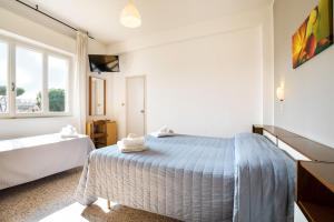 Posteľ alebo postele v izbe v ubytovaní Hotel Ausonia B&B RiMiNi