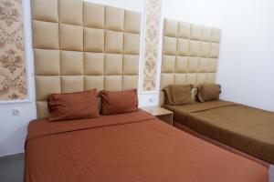 Letto o letti in una camera di Griya Limasan Gunung Kidul
