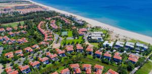 an aerial view of a resort on the beach at Ocean Luxury Villas Danang in Da Nang