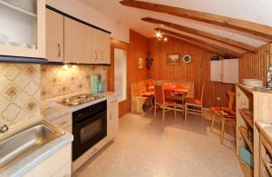 a kitchen with a sink and a table at FW Winterer in Zwiesel
