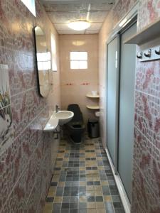 a bathroom with a toilet and a sink at Apartment kata in Kata Beach +15 photos