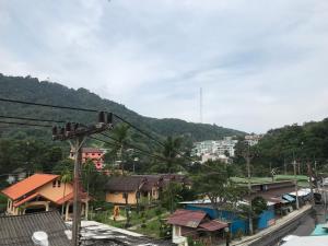 a view of a town with houses and a mountain at Apartment kata in Kata Beach
