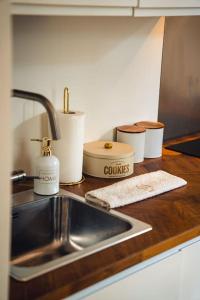a kitchen counter with a sink and some containers on it at Casa N in Arona +41 photos