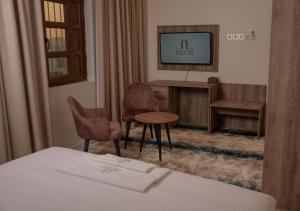 Letto o letti in una camera di فندق المدينة القديمة Old Town Hotel