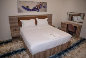 Letto o letti in una camera di فندق المدينة القديمة Old Town Hotel