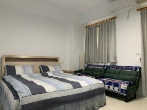 Voodi või voodid majutusasutuse Daiwen Homestay toas
