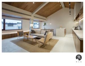 a living room with a couch and a table at Jiangnan House Jingwenli in Suzhou